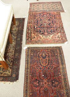 Four piece lot of Oriental throw rugs, to include one Sarook 2' x 4', two Hamaden 2' 5" x 3' 10", 2' 6" x 4' 6", one Belouch 1' 7" x 2' 10".