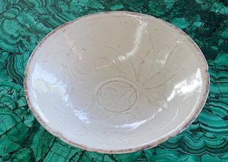 A Chinese White Glazed Molded Flower Bowl