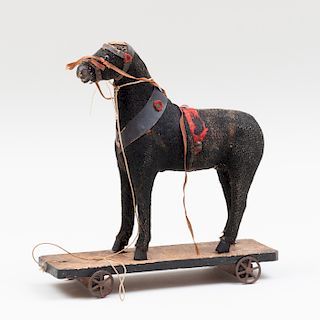 Fabric Covered Model of a Toy Horse on a Wheeled Base