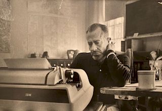 Photo of John Steinbeck writing by Erich Hartman