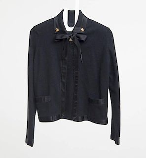 BLACK CARDIGAN WITH SILK NECKTIE AND CHANEL-TYPE COLLAR BUTTONS, LACKING LABEL, PROBABLY CHANEL