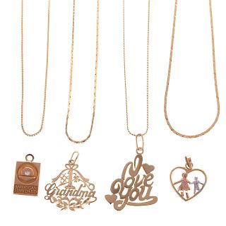 A Collection of Charms & Chains in Gold