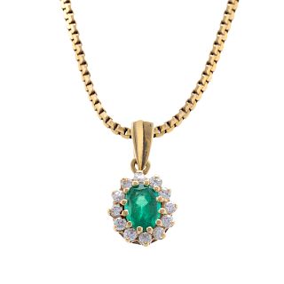 A Ladies Oval Emerald & Diamond Pendant in 14K
