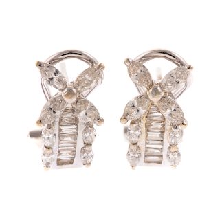 A Ladies Pair of Diamond Earrings in 18K Gold