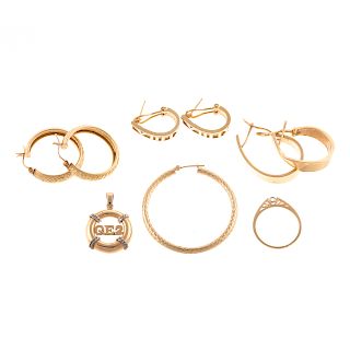 An Assortment of Gold Jewelry and Earrings