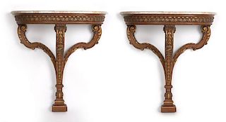 A pair of gilt and carved wood console tables