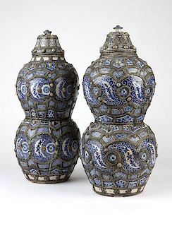 Near pair of Moroccan metal-mounted ceramic jars