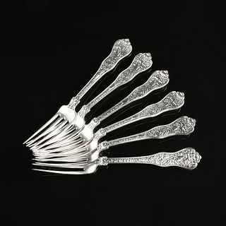 A RARE SET OF TWELVE TIFFANY & CO. STERLING SILVER DINNER FORKS, OLYMPIAN PATTERN, ZEUS WITH HIS CHILDREN, NEW YORK, CIRCA 1878,