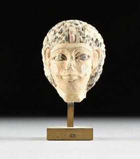 AN ANCIENT EGYPTIAN CARVED AND PAINTED LIMESTONE PORTRAIT HEAD OF A ROYAL PRINCESS, POSSIBLY OLD KINGDOM, 6TH DYNASTY, CIRCA 2345 - 2181 BC,