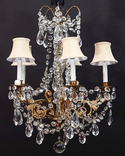A GILT BRONZE AND CRYSTAL CHANDELIER