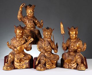 FOUR 19TH CENT. CHINESE CARVED AND GILDED WOOD FIGURES