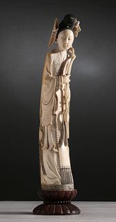 A CHINESE CARVED IVORY FIGURE OF A BEAUTY