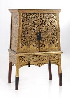 A 20TH C. THAI GILT BLACK LACQUER CABINET WITH BUDDHAS