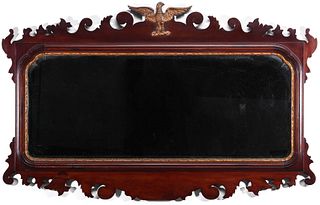 A HORIZONTAL FORMAT SCROLL CUT CHIPPENDALE STYLE MIRROR