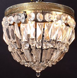 A BRASS AND CRYSTAL CEILING LIGHT FIXTURE