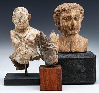 A COLLECTION OF EARLY CARVED WOOD SCULPTURE FRAGMENTS
