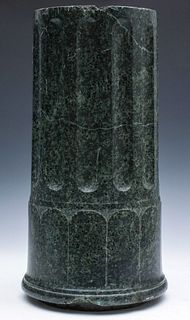 A FLUTED AND ENGRAVED GREEN MARBLE COLUMN FRAGMENT