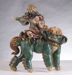 AN ANTIQUE CHINESE GLAZED FIGURAL ROOF TILE