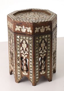 A CONTAINER IN THE FORM OF A PEARL INLAID MOORISH TABLE