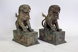 A Pair of Large Bronze Foo Dogs.