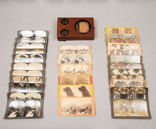 Estereocopio con diapositivas. Inicios siglo XX.Estereoscopio en madera, lentes convexas y latón. Incluye 30 diapositivas de cartulina.