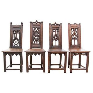 Lot of 4 chairs. France. 20th Century. Gothic Style. Carved in oak. Semi-open backrests.