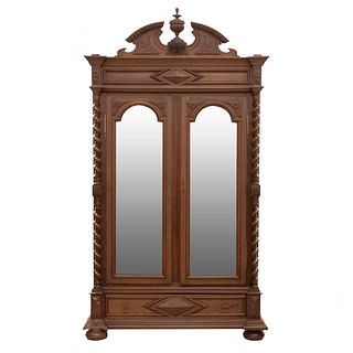 Closet. France. 20th Century. Walnut. 2 hinged doors with beveled mirrors and drawer. 114 x 63.7 x 23.2" (290 x 162 x 59 cm.)