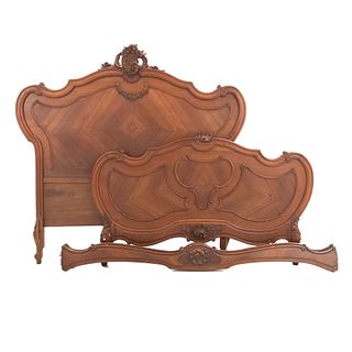 Double bed. France. 20th Century. Louis XV. Carved in walnut. Headboard, footboard, and 2 stringers.