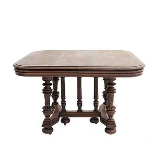Table. France. 20th Century. Henri II. Walnut. With rectangular top extendable system. 28.3 x 45 x 40.5" (72 x 115 x 103 cm).