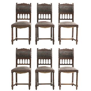 Lot of 6 chairs. France. 20th Century. Henri II. Carved in walnut. Upholstery in maroon-colored leather.