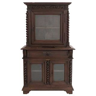 Display case. France. 20th Century. Henri II. Carved in oak. With drawer, 3 doors with glass and shelves. 72 x 42.5 x 23.2" (183 x 108 x 59 cm)