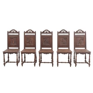 Lot of 5 chairs. France. 20th Century. Breton style. Carved in oak. Semi-open back rests.