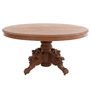 Pedestal Table. France. 20th Century. Henri II. Carved in walnut. Oval top with extendable system. 28.3 x 56.6 x 50" (72 x 144 x 126 cm)
