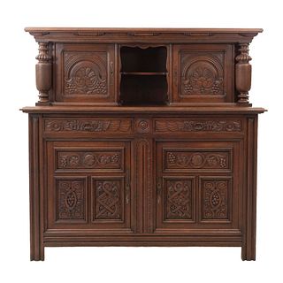 Buffet or Sideboard. France. 20th Century. Carved in oak. Hollow central space w/shelf, 2 drawers and 4 doors. 64.5 x 66.9 x 20.4" (164 x 170 x 52 cm)