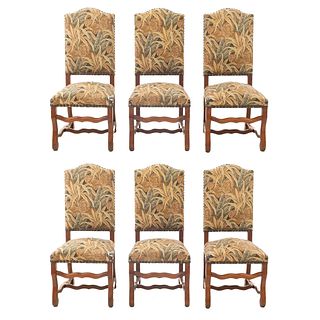 Lote of 6 chairs. France. 20th Century. Carved in oak. Closed backrests upholded in vegetable-motif upholstery.