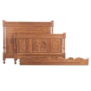 Double bed. France. 20th Century. Breton Style. Carved in oak. With headboard, footboard, 2 stringers and bun-style supports.
