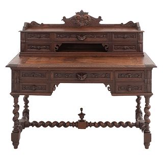 Desk. France. 20th Century. Henri II. Carved in oak. With 9 drawers and superior, open compartment. 47 x 51 x 24.8" (120 x 130 x 63 cm)