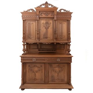 Buffet or Sideboard. France. 20th Century. Henri II. Carved in walnut. With 2 drawers and 5 doors. 100.3 x 59 x 22.4" (255 x 150 x 57 cm)