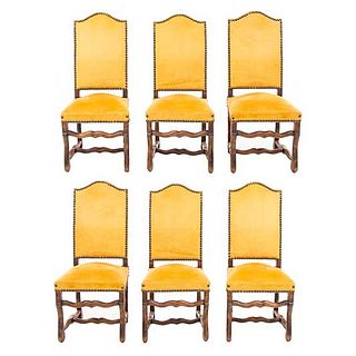 Lot of 6 chairs. France. 20th Century. Carved in oak. Closed backrests, upholstered in yellow cloth.