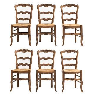 Lot of 6 chairs. France. 20th Century. Louis XV. Carved in oak. Semi-open backrests with seats made from woven palm.