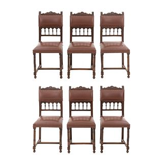 Lot of 6 chairs. France. 20th Century. Henri II. Carved in wlanut. Semi-open backrests and seats in faux leather.