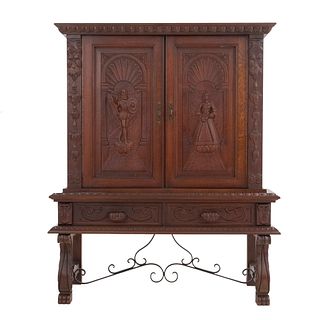 Cabinet. France. 20th Century. Carved in oak. With 2 hinged doors and 2 drawers with handles. 63 x 49 x 18.5" (160 x 125 x 47 cm)