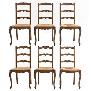 Lot of 6 chairs. France. 20th Century. Louis XV. Carved in oak. Semi-open backrests and seats in woven palm.