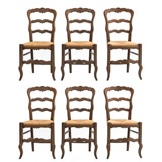Lot of 6 chairs. France. 20th Century. Louis XV. Carved in oak. Semi-open backrests and seats woven in palm.