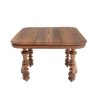 Table. France. 20th Century. Henri II. Carved in walnut. With extendable system. 29 x 42 x 44.4" (74 x 107 x 113 cm)