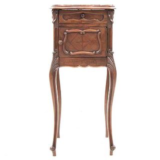 Nightstand. France. 20th Century. Louis XV. Carved in walnut. Red marbled top cover, drawer and door. 34 x 15.7 x 15.7" (87 x 40 x 40 cm)