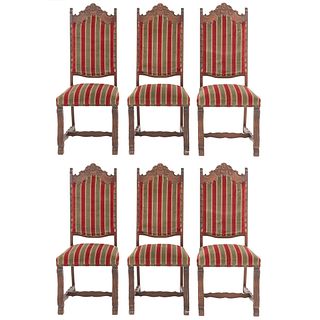 Lot of 6 chairs. France. 20th Century. Carved in oak. Closed backrestsand seats upholstered in green and red striped cloth.