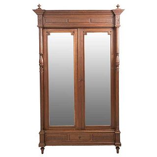 Wardrobe. France. 20th Century. Henri II. Carved in walnutl. With drawer and 2 doors with mirrors. 91.7 x 51 x 19.6" (233 x 130 x 50 cm)