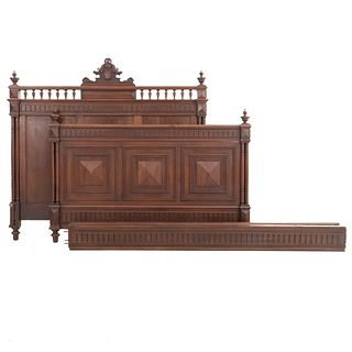 Double bed. France. 20th Century. Henri II. Carved in walnut. With headboard, footboard, and 2 stringers.