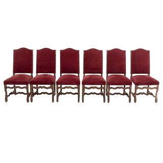 Lot of 6 chairs. France. 20th Century. Carved in oak. Closed backrests and seats upholstered in wine-colored cloth.